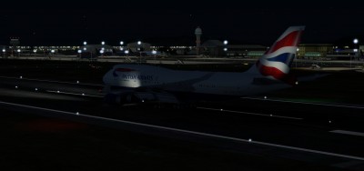 Snapshot arriving from London by night. The terminal and parked aircraft are non lightened.